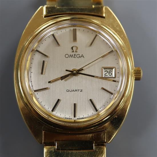 A gentleman's 1980's gold plated Omega quartz wrist watch, on Omega bracelet.